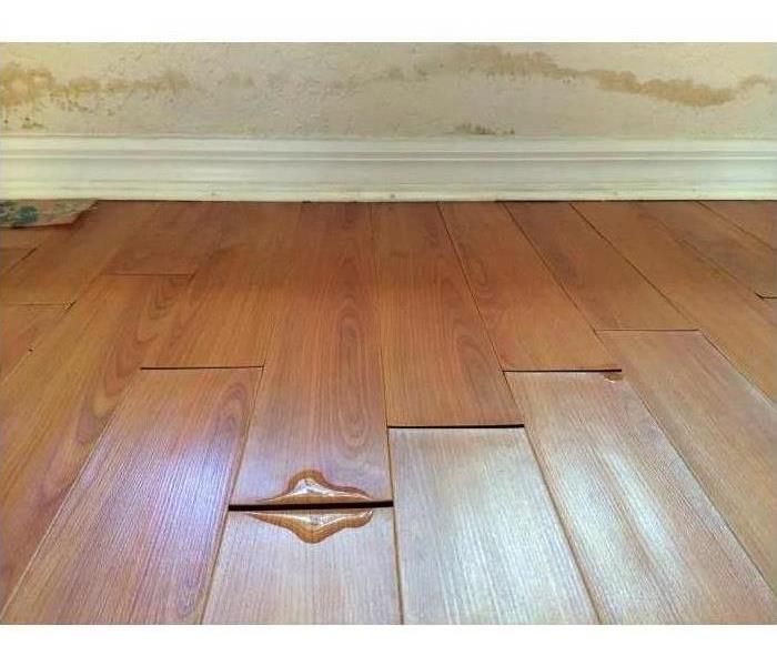 Water leaking through wooden floor